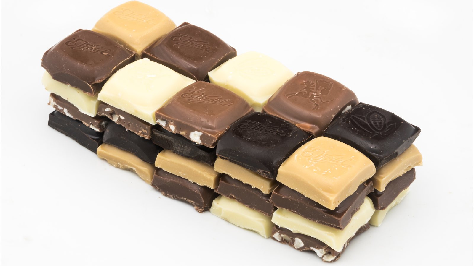 Squares of dark chocolate arranged in a row